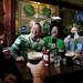 Ann Arbor residents Tim Belinger and Tim Neff (left) drink and laugh with friends at Conor O'Neill's on Sunday, March 17. Daniel Brenner I AnnArbor.com